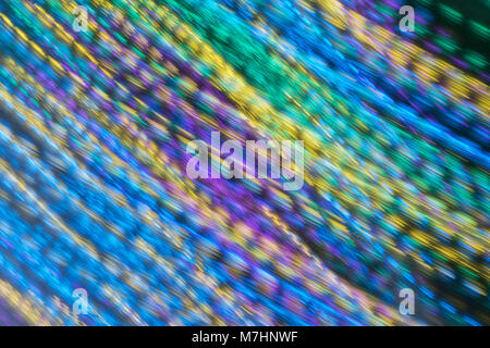 Motion blur of colored lights at carnival creates interesting abstract motion blurred background. Stock Photo