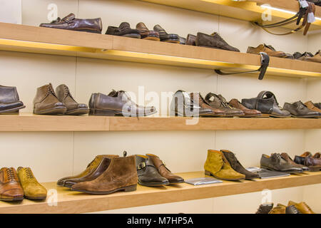 Display of beautiful leather man's shoes in shop Stock Photo