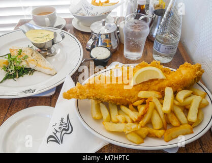 Lunch for two at the famous Magpie Café in Whitby North Yorkshire England UK one fried Haddock and Chips and a Hake with Samphire and Béarnaise sauce Stock Photo