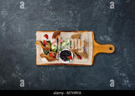 Chicken pate with plum sauce, served with croutons. Top view Stock Photo