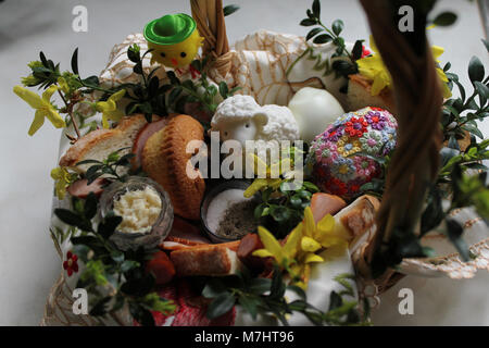 Easter decoration with eggs. Spring bouquet of blossoming daffodils. Stock Photo