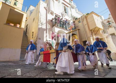 PROCIDA, ITALY - MARCH 25, 2016 - Every year the procession of the 'Misteri' is celebrated at Easter's Good Friday in Procida, Italy. Islanders carry through the streets elaborate and heavy 'Misteries' representing scenes from The Bible. Even the children are involved in the procession. Stock Photo
