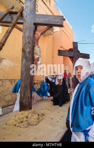 PROCIDA, ITALY - MARCH 25, 2016 - Every year the procession of the 'Misteri' is celebrated at Easter's Good Friday in Procida, Italy. Islanders carry through the streets elaborate and heavy 'Misteries' representing scenes from The Bible. Even the children are involved in the procession. Stock Photo