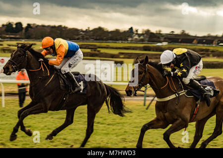 Hereford, Herefordshire, UK. 10th March, 2018. Flashjack leads ahead of The Cider Maker during the 2:50pm race at Hereford racecourse during Ladies Day in Hereford on 10th March 2018. Credit: Jim Wood/Alamy Live News Stock Photo