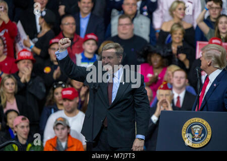 Moon Township, USA. 10th Mar, 2018. Rick Saccone, Republican Congressional candidate for Pennsylvania's 18th district, appears on stage with United States President Donald J. Trump as he speaks to supporters during a Make American Great Rally at Atlantic Aviation in Moon Township, Pennsylvania on March 10th, 2018. Credit: Alex Edelman/CNP · NO WIRE SERVICE · Credit: Alex Edelman/Consolidated/dpa/Alamy Live News