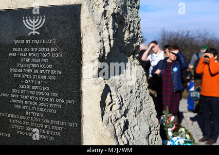 Krakow, Poland, Poland. 11th March, 2018. Memorial plaque in Hebrew on the site of the former concentration camp Krakow-Plaszow. Credit: Filip Radwanski/Alamy Live News Stock Photo