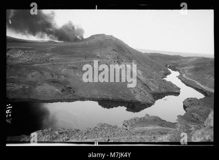 Iraq. Oil wells and camp of the Iraq Petroleum Company. (5 miles S. of Kirkuk). Kirkuk District. A river of crude oil. Result of an uncontrolled gusher LOC matpc.16249 Stock Photo