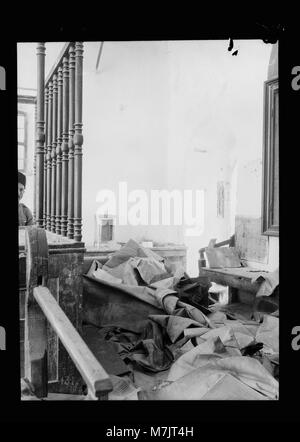 Palestine events. The 1929 riots, August 23 to 31. Synagogue desecrated by Arab rioters. Hebron. Large scroll in a jumbled heap on the floor LOC matpc.15705 Stock Photo