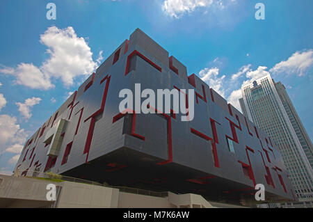 Looking like a massive cube puzzel, the Guangdong Museum sits next to the Guangzhou Opera House in Guangzhou, Guangdong province, People's Republic of Stock Photo