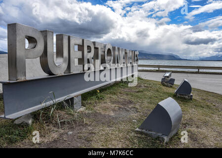 A sign welcoming visitors to the town of Puerto Natales, Chile Stock Photo