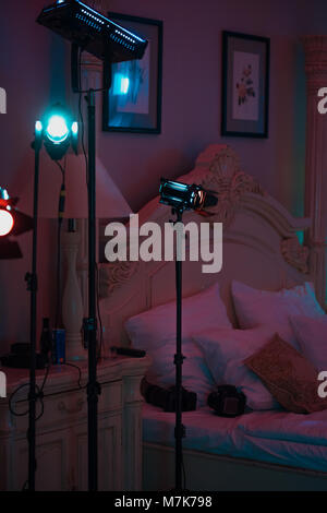 Professional cinema lamps with continuous light standing in the dark room. Stock Photo