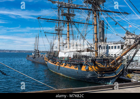 SAN DIEGO, CALIFORNIA, USA - HMS Surprise Replica British Frigate and maritime museum, and B-39 Soviet Submarine docked in San Diego Harbor. Stock Photo