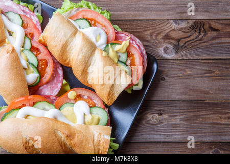 Baguette with sausage and vegetables Stock Photo