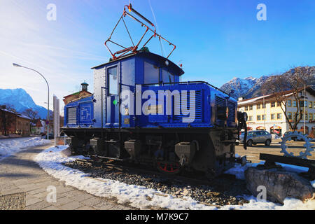 Garmisch-Partenkirchen, Germany - January 6, 2015: Discarded electric cog locomotive of the Bavarian Zugspitze Cog Railway back on the base of the mou Stock Photo