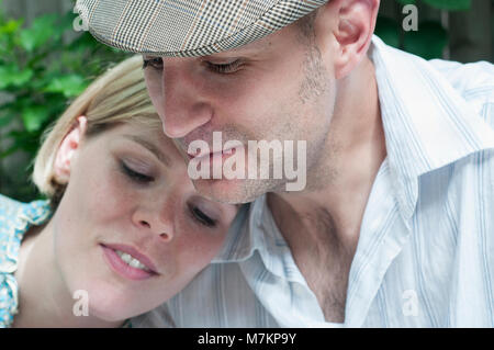 A close up of a couple looking away from the camera. Stock Photo