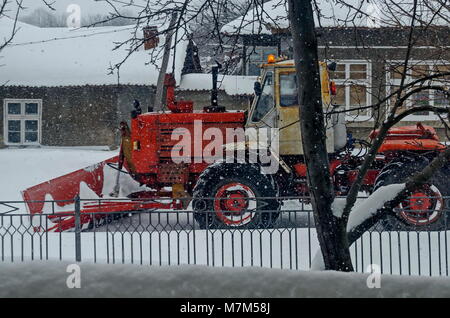 Snow plough removing snow from road in winter storm, Zavet, Bulgaria, Europe Stock Photo