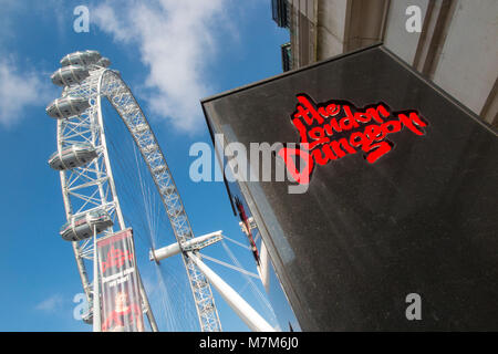 Tourism attractions in London - The London Dungeon and The London Eye Stock Photo