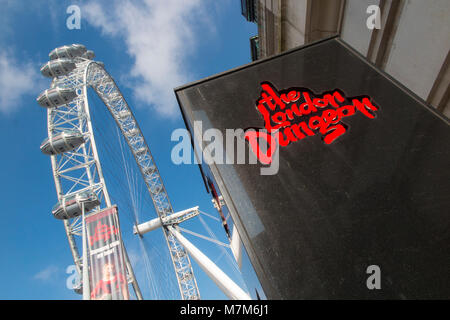 Tourism attractions in London - The London Dungeon and The London Eye Stock Photo