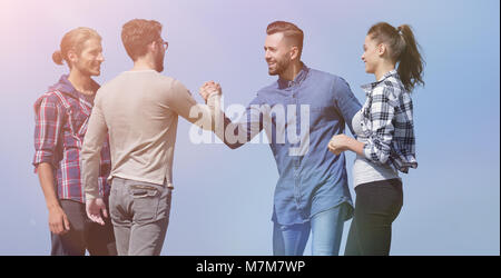 friends greet each other with a handshake Stock Photo