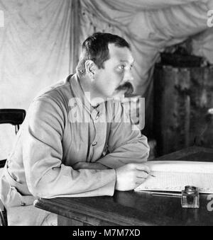 The British writer and physician, Sir Arthur Conan Doyle, creator of Sherlock Holmes in his tent at Bloemfontein, South Africa, during the Second Boer War - where he served as a medic. Photo by Keystone, 1900. Stock Photo