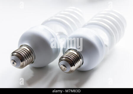 Two energy efficient high power fluorescent photographic light bulbs on a white background Stock Photo