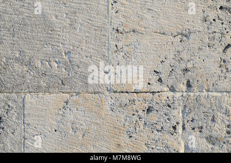 Beige and grey stone wall suitable as a background Stock Photo