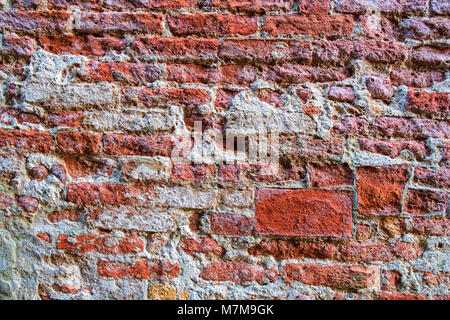 Old red brick wall texture background in Venice. Stock Photo