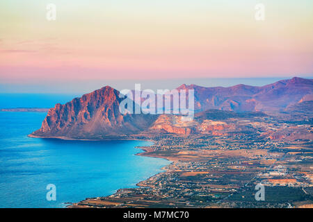 Panoramic view towards Monte Cofano seen from Erice, Sicily island, Italy. At sunset. San Vito lo Capo on the background Stock Photo