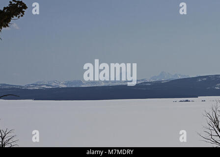 Frozen Yellowstone Lake and Teton Mountains  Yellowstone Lake and Teton Mountains as seen from Lake Butte Overlook; Stock Photo