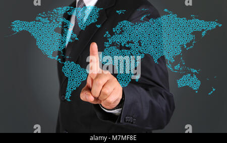 Business man touching graphic of world map. Stock Photo
