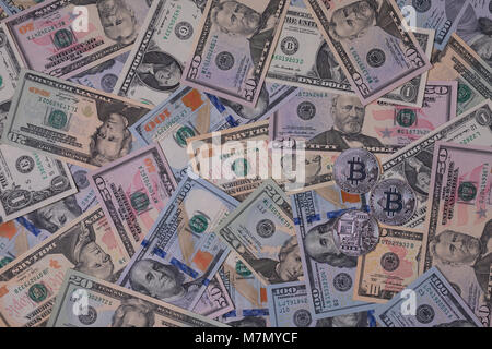 Silver bitcoin on dollars abstract background. Crypto-currency Stock Photo