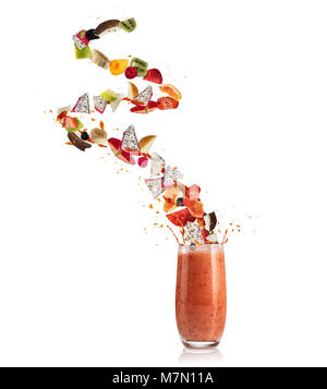 Smoothie drink with fruit flying ingredients, isolated on white background. Healthy drink and lifestyle Stock Photo