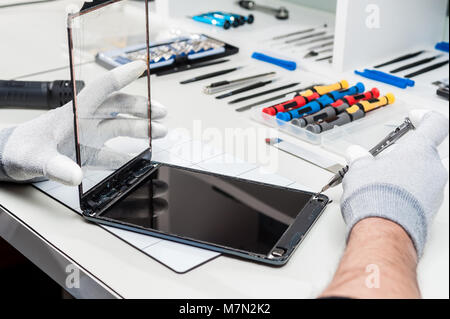 Close-up photos showing process of tablet device repair Stock Photo