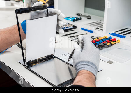 Close-up photos showing process of tablet device repair Stock Photo