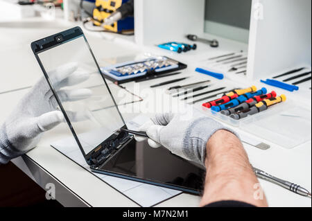 Close-up photos showing process of tablet device repair Stock Photo