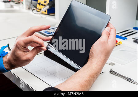 Close-up photos showing process of tablet device repair Stock Photo