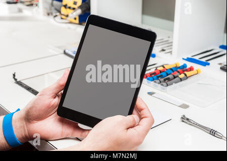 Close-up photos showing process of tablet device repair Stock Photo