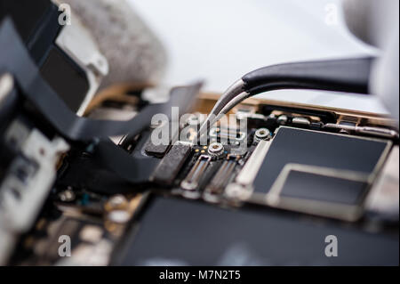 Close-up photos showing process of mobile phone repair. Stock Photo