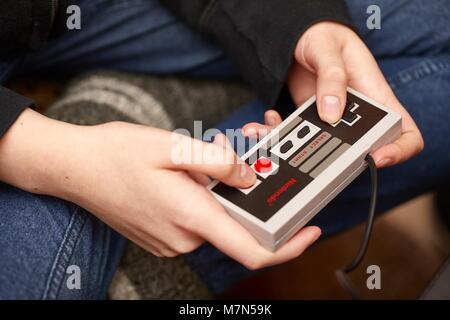 Nintengo NES,playing Super Mario 3 Stock Photo