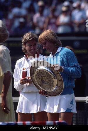 Martina Navratilova and Chris Evert following their 1984 Wimbledon final, which Navratilova won Stock Photo