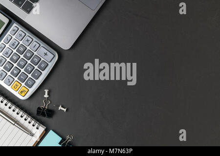 Office black stone desk table with calculator, laptop and pen,  business background concept and copy space Stock Photo