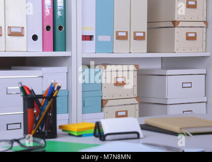Modern office interior with tables, chairs and bookcases. Stock Photo