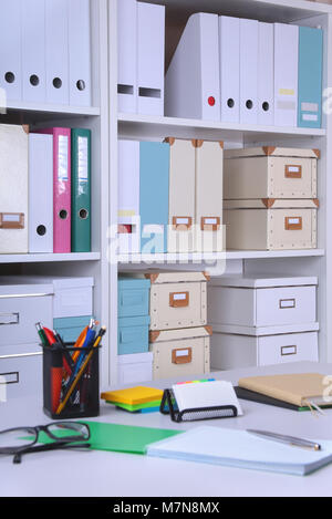 Modern office interior with tables, chairs and bookcases. Stock Photo