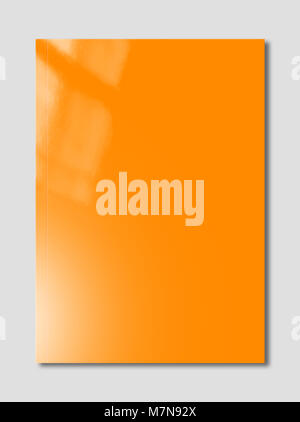 Orange booklet cover isolated on grey background, mockup template Stock Photo