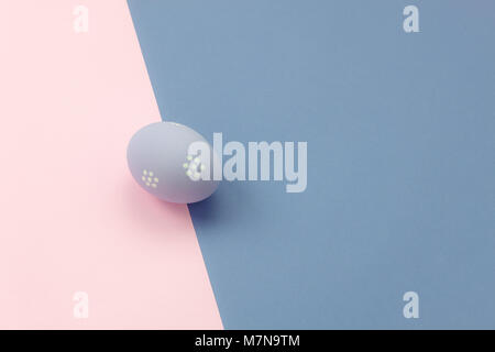 Top view shot of arrangement decoration Happy Easter holiday background concept.Flat lay colorful bunny eggs on modern beautiful pink paper & purple a Stock Photo