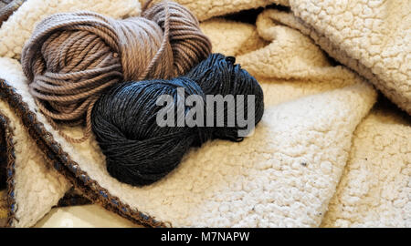 Yarn and knitting needles on the table in the room Stock Photo