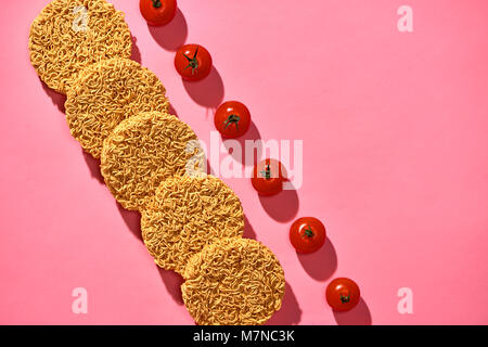 Dried instant noodles isolated on a pink background Stock Photo