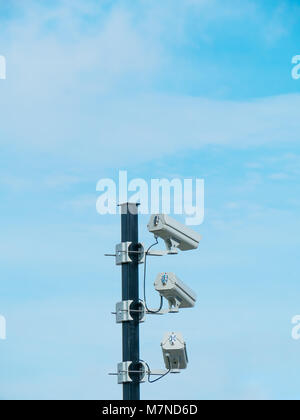 closed-circuit camera on white clouds background, Stock Photo