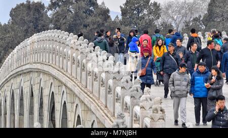 Beijing, China. 11th Mar, 2018. People enjoy their leisure time at the Summer Palace in Beijing, capital of China, March 11, 2018. Credit: Li Xin/Xinhua/Alamy Live News Stock Photo