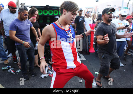 Miami, USA. 11th Mar, 2018. People dance to Latin music during the 41st annual Calle Ocho Festival on SW 8th Street in the Little Havana community as part of Carnaval Miami on March 11, 2018 in Miami, Florida.  (Photo by Sean Drakes/Alamy Live News) Credit: SEAN DRAKES/Alamy Live News Stock Photo